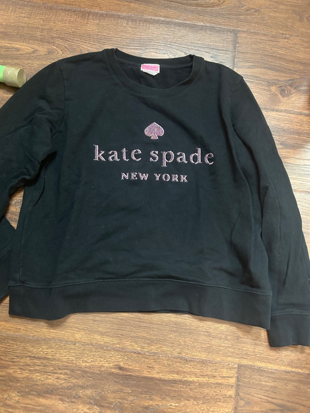 kate spade black crewneck sweatshirt with pink-purple glitter logo